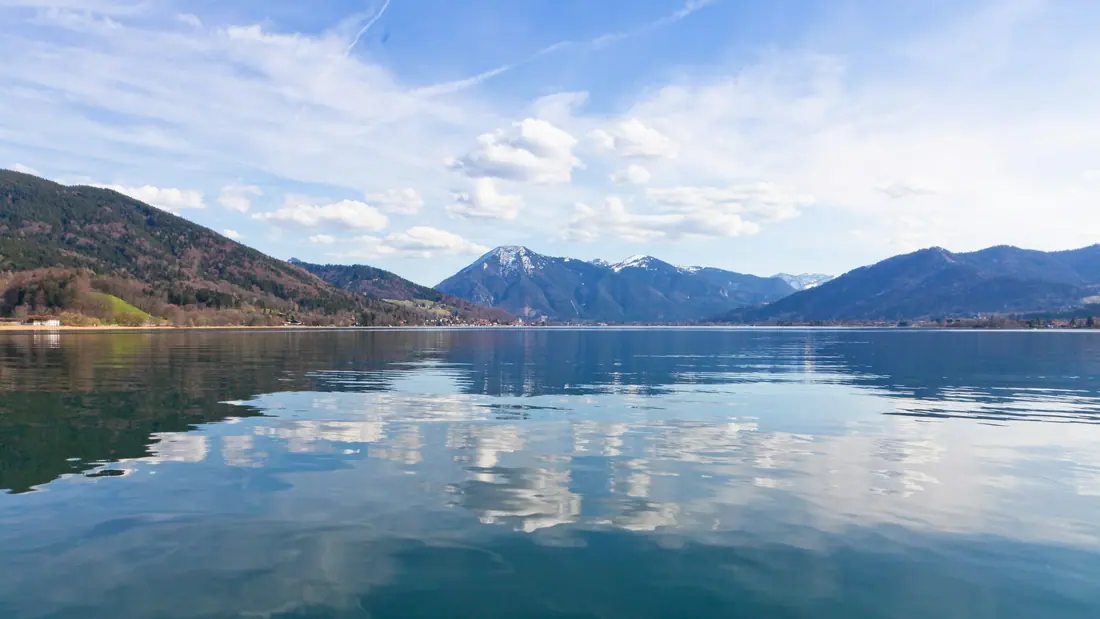 Lake Tegernsee with the Bavarian Alps behind, the sky reflected in still water